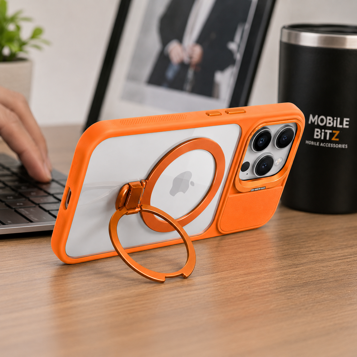 BitzShield Camera Guard Ring Stand MagSafe Case for iPhone 15 Pro Max displayed on a modern workspace desk